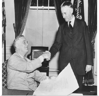 President Franklin Roosevelt shaking hands with his new Secretary of War
