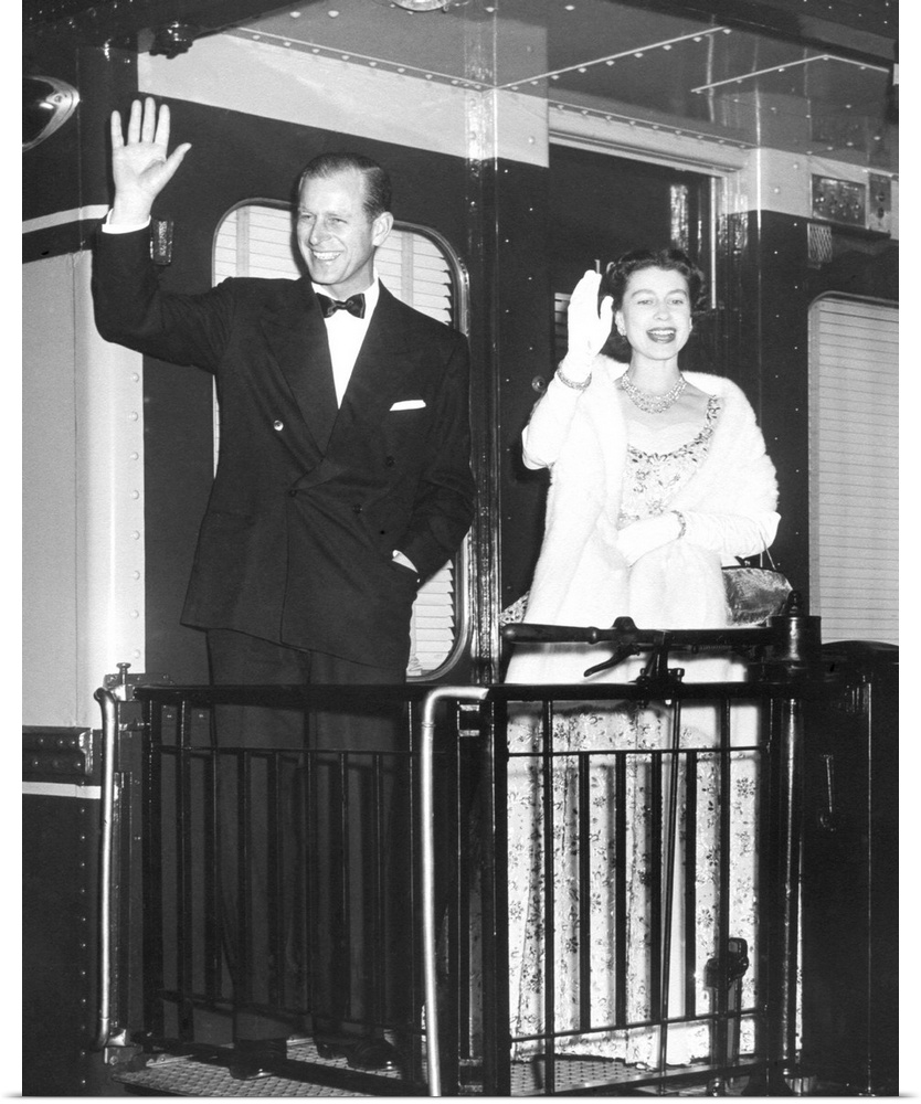 Queen Elizabeth II and Prince Philip wave from the back of a train at Union Station. After entertaining the President Eise...