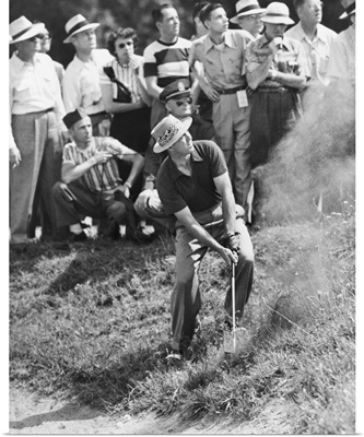 Sam Snead makes an iron shot from the side of a sand trap