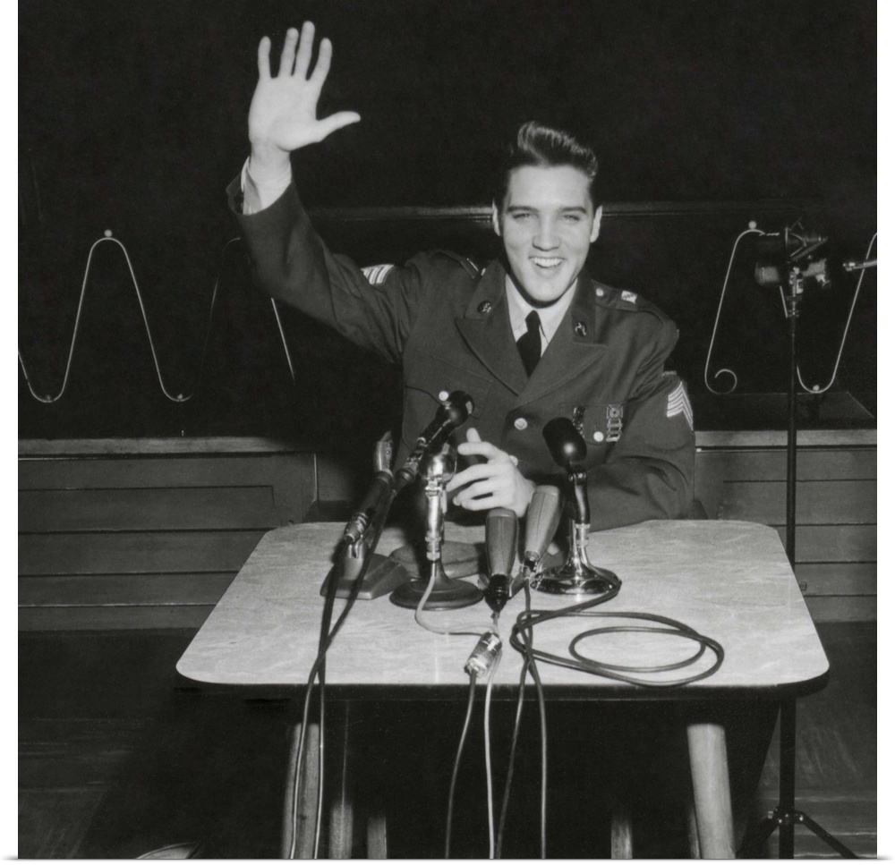 Sgt. Elvis A. Presley answers question for the civilian and military press. March 1, 1960. When asked why he served as a r...
