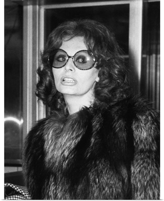 Sophia Loren in large sunglasses and fur at Rome's airport, May 14, 1974