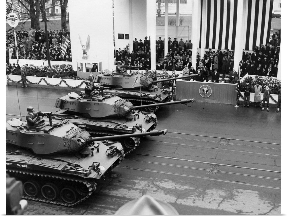 U.S. Army tanks pass Eisenhower's reviewing stand during the Inaugural parade. Jan 21, 1957.