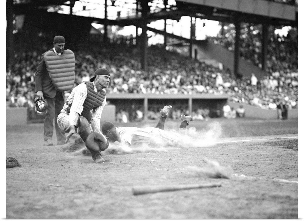 Yankees Lou Gehrig scores as Joe Harris' throw gets away from catcher Hank Severeid of Senators. New York Yankees beat Was...