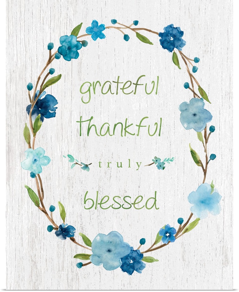 "Grateful, Thankful, Truly Blessed" placed on a white textured background with blue flowers surrounding it.
