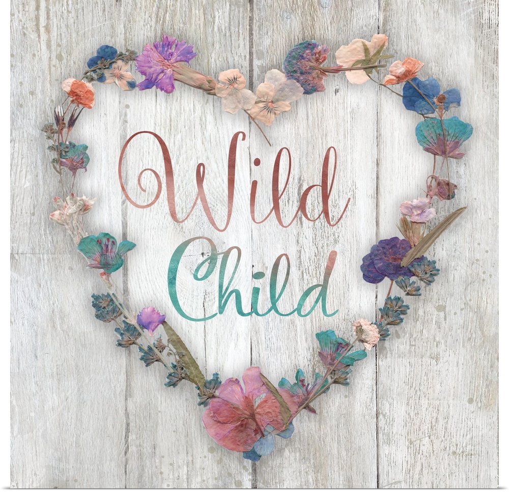 "Wild Child" placed on a white washed wood texture with dried flowers surrounding it.
