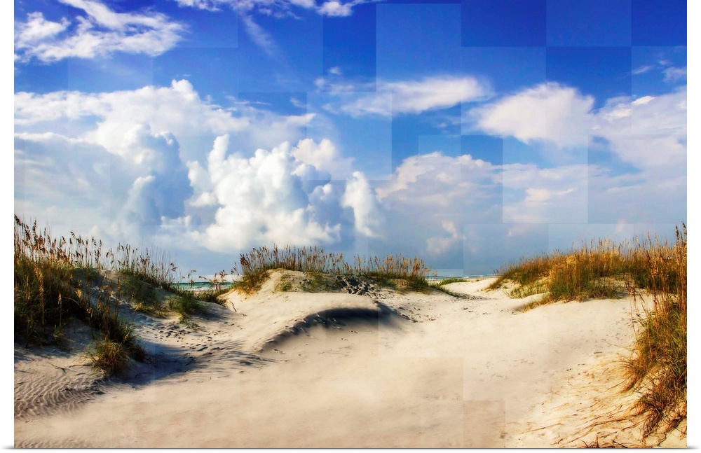 A sandy beach under a bright blue sky, with square shapes in the sky.