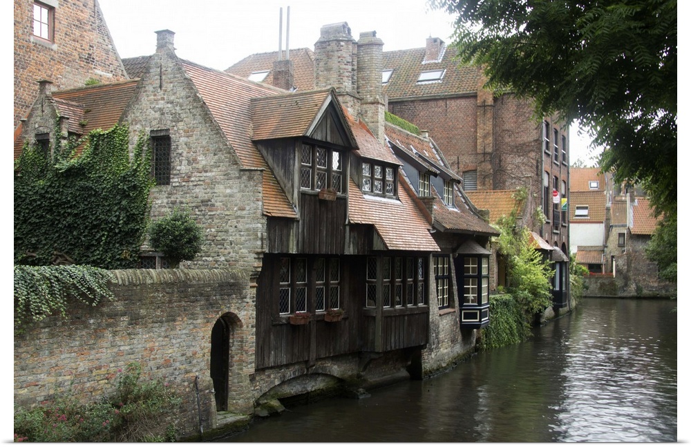 Photograph of old houses on the edge of the river in Belgium.