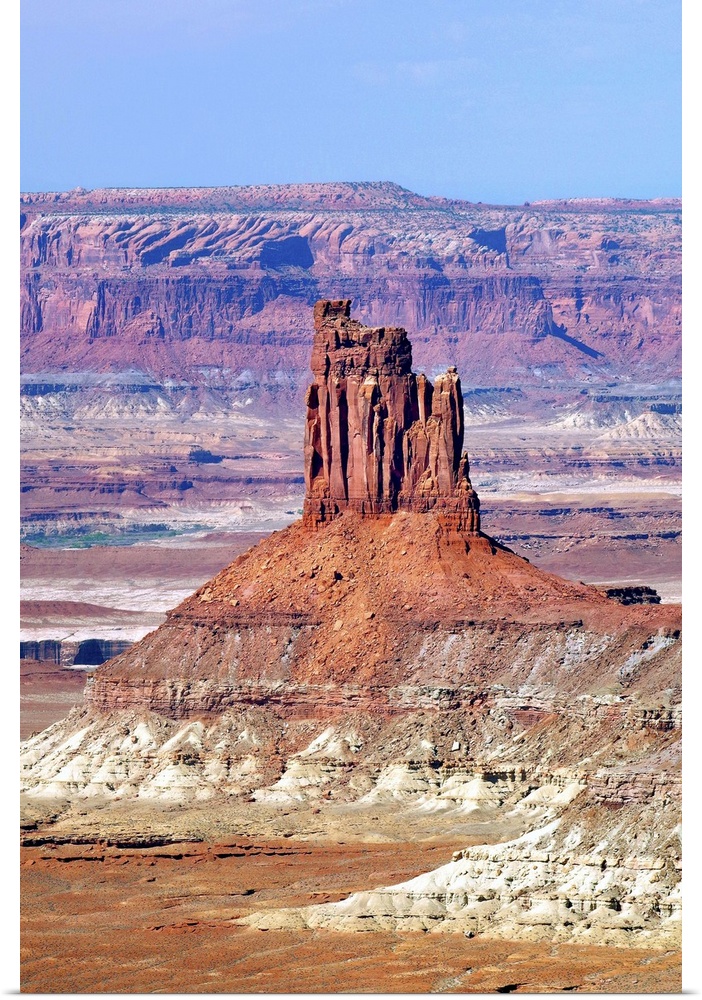 A tall rock formation in the desert landscape of Utah.
