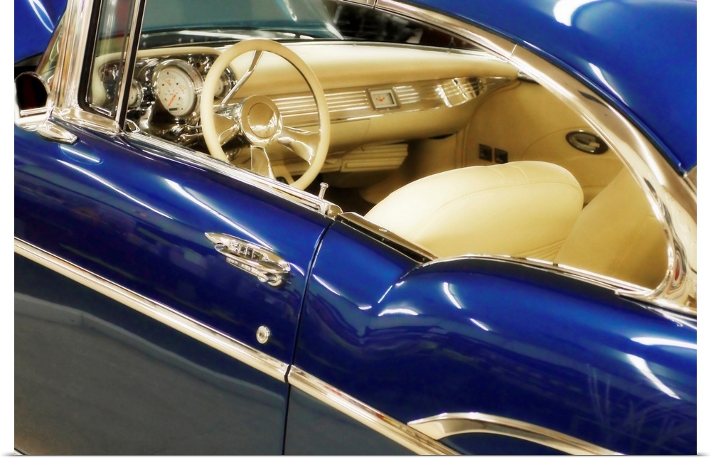 This horizontal photograph is a close up of the interior of an antique car.