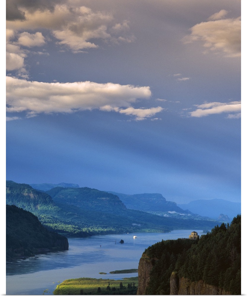 A bright blue sky with clouds over the Columbia River Gorge.