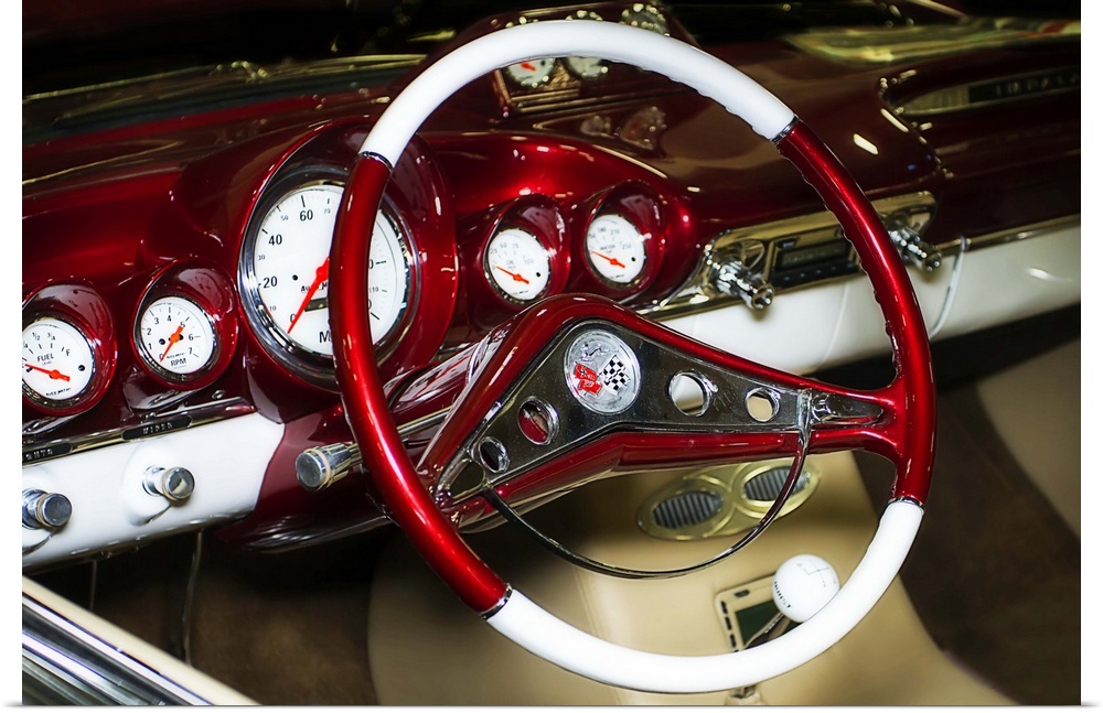 Fine art photograph of the retro steering wheel and dashboard of a vintage car.