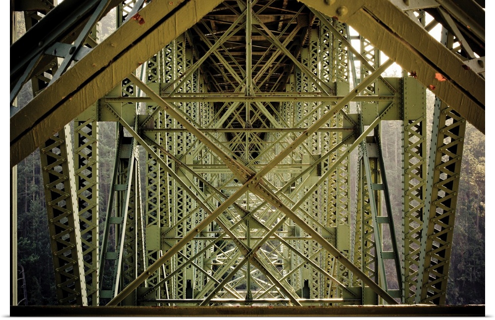Up-close photograph of architectural detail of iron bridge.