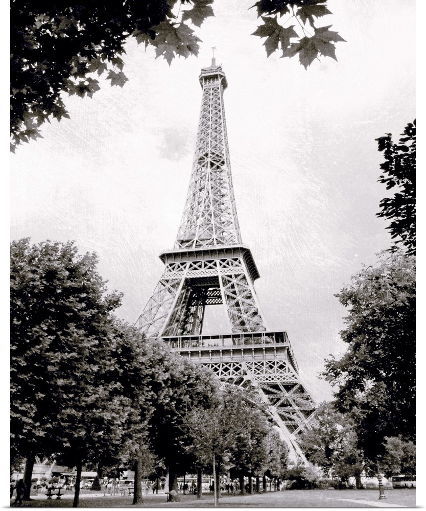 Large vertical black-and-white photograph of the Eiffel Tower in Paris, France.
