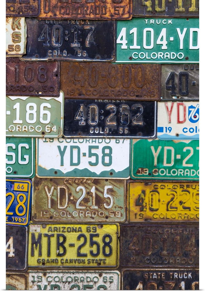 A collection of vintage license plates.