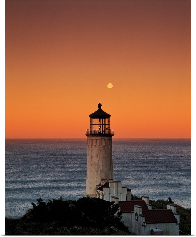 A lighthouse overlooking the ocean at sunset, Washington.