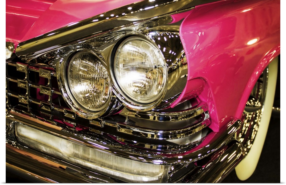 Fine art photograph of the headlights of a hot pink vintage car.