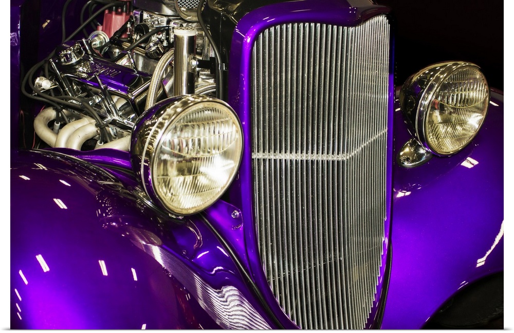 Fine art photograph of a vintage car. The engine is visible behind the headlights and grill.