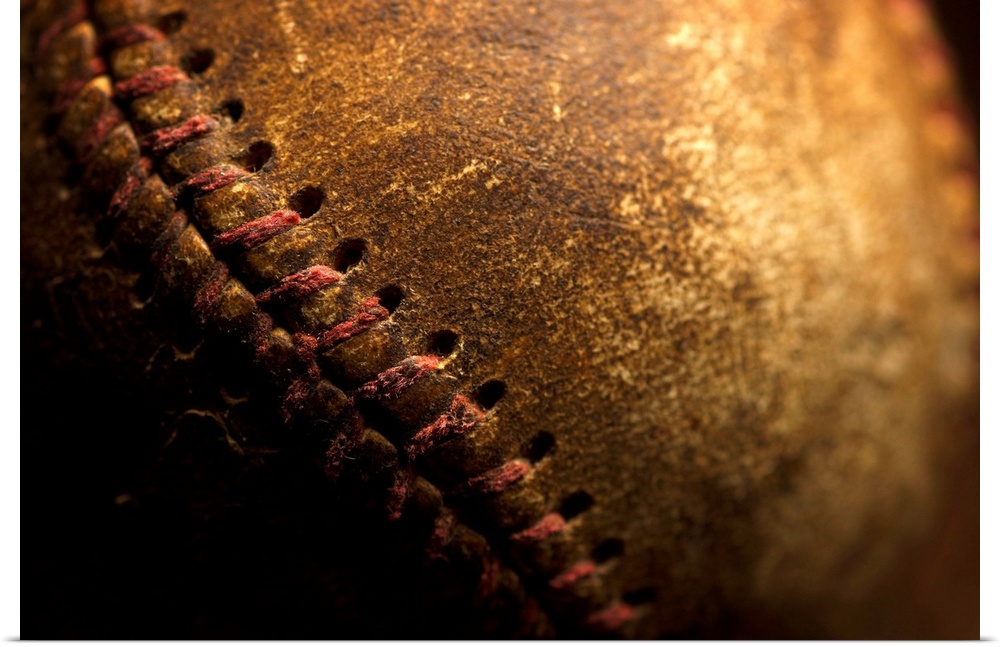 A closeup of an old baseball. Shot with shallow depth of field.