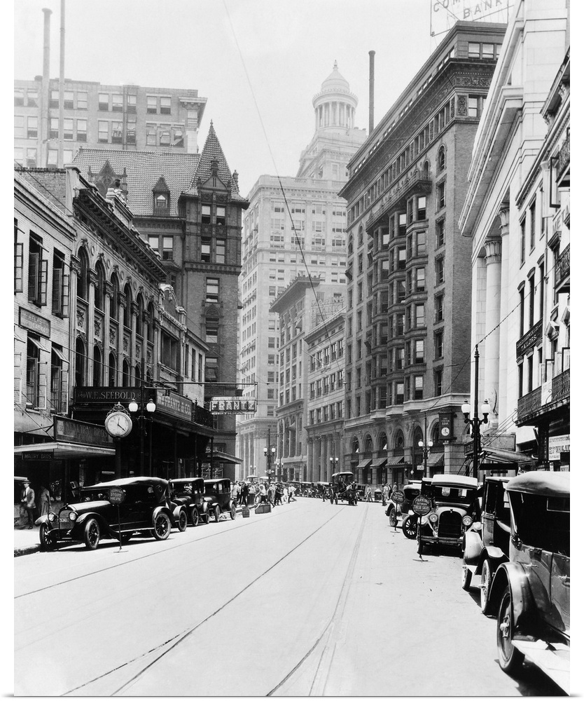 Carondelet Street looking south. On the right; the Federal Reserve Bank, the Maritime Building, the Marine Building, the N...