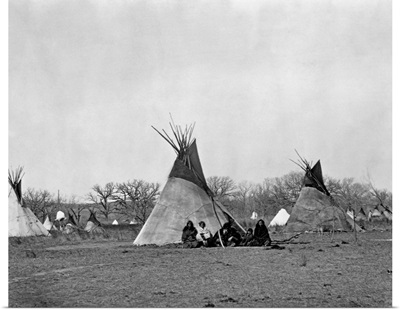 A Native American Family Sits Outside Their Teepee