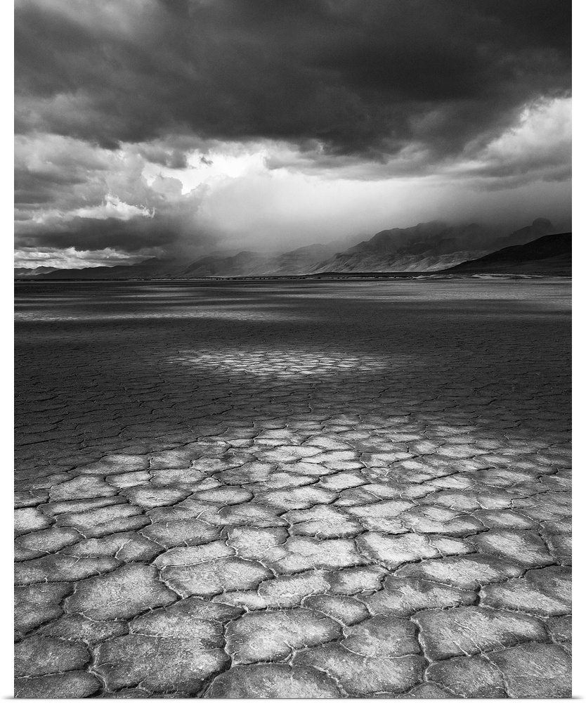 A rainstorm travels over Steens Mountain as seen from the Alvord Desert in Oregon.