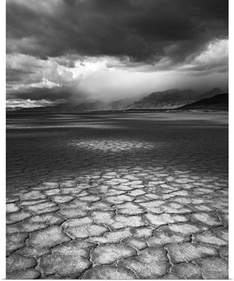 A rainstorm travels over Steens Mountain as seen from the Alvord Desert in Oregon.
