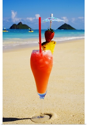 A tropical cocktail on the beach, Mokulua Islands and kayakers in background.