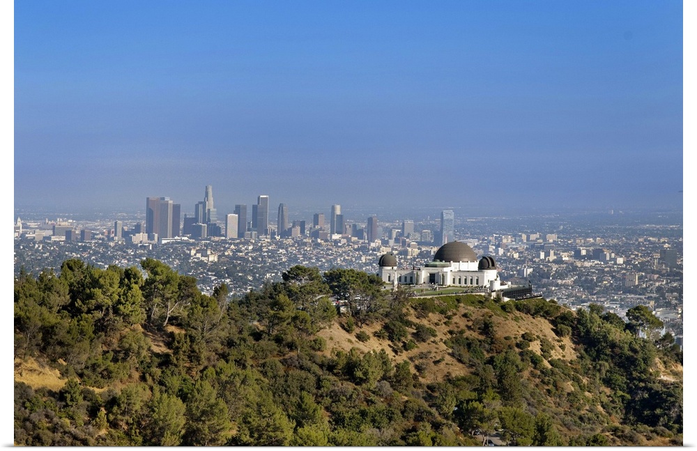 A view from a hiking trail in Griffith Park of the Griffith Park Observatory and downtown Los Angeles.