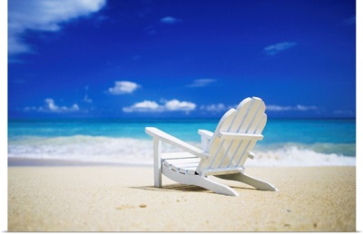 Adirondack chair sitting on a beach in Honolulu, Hawaii