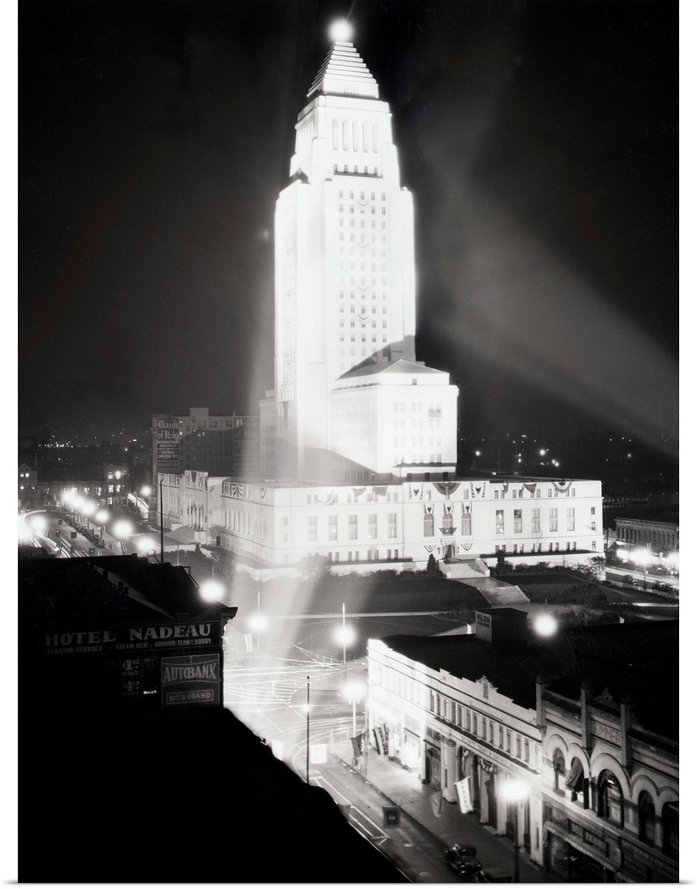 1930-Los Angeles, California: Aerial view of City Hall, at night.