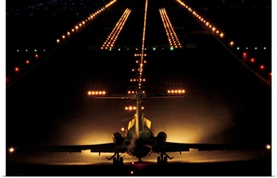 Airplane on runway at night