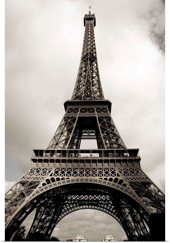 Black and white photograph taken vertically looking up at the Eiffel Tower.