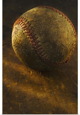 Antique baseball on wooden floor