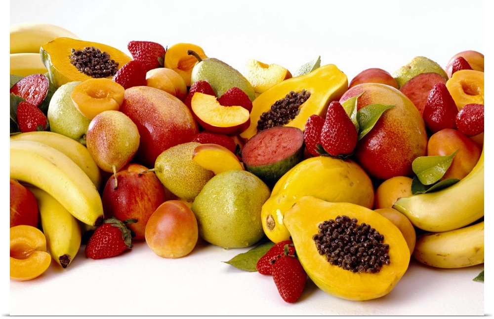 Group of fresh fruit including bananas, papayas, strawberries, melons, mangoes, and apricots.