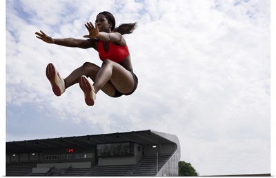 Athlete in midair during long jump