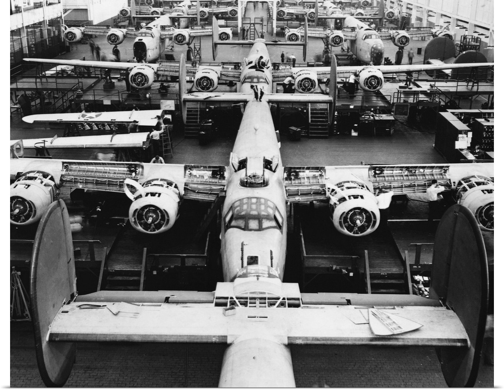 B-24 bombers under construction at a plant in Michigan during World War II. | Location: Willow Run, Michigan, USA.