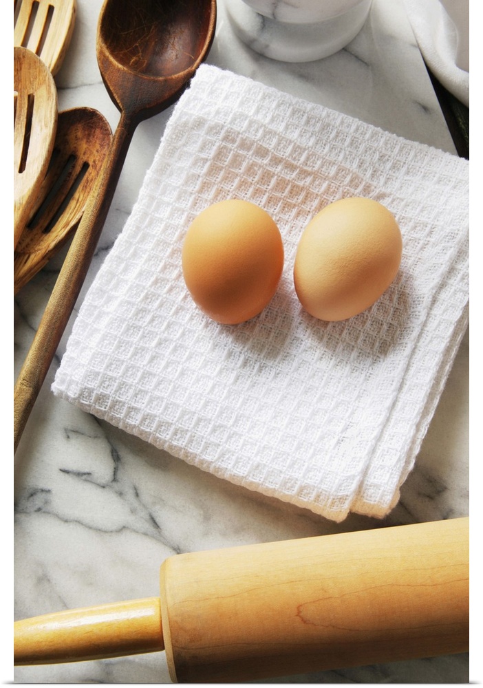 Baking tools and egg on napkin