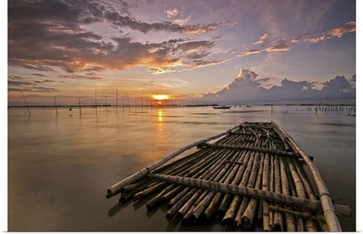 Bamboo raft at sunset.
