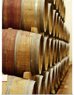 barrels of wine in a warehouse