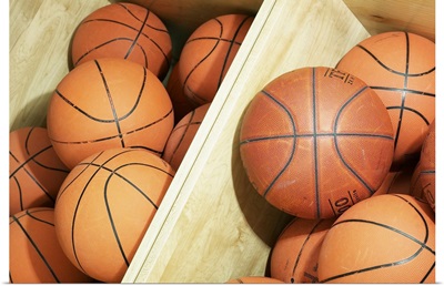 Basketballs in storage bin