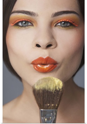 Beauty portrait of woman flowing make up of brush