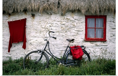 Bike in front of cottage, Isle of Man
