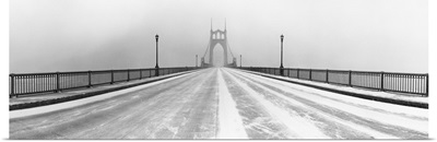 Black and white panorama of St. Johns Bridge in Portland, Oregon in winter snow storm.
