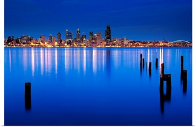 Blue hour view of downtown Seattle across Elliott bay, from nearby Alki in West Seattle.