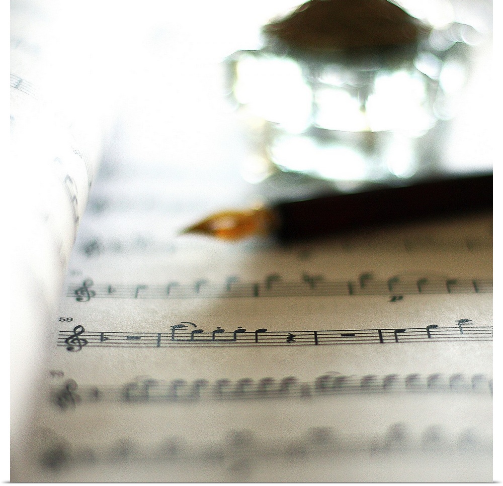 Bokeh with sheet music, fountain pen and inkwell.