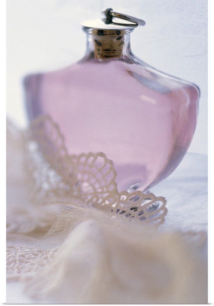 Bottle of perfume with lace