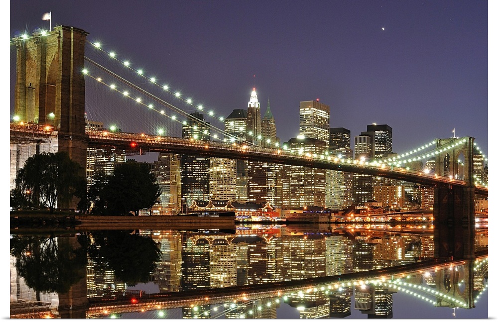 Beautiful artwork for the home or office of the Brooklyn Bridge illuminated at night with the skyline just behind it lit u...