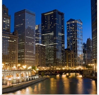 Buildings along the Chicago riverfront at dusk.