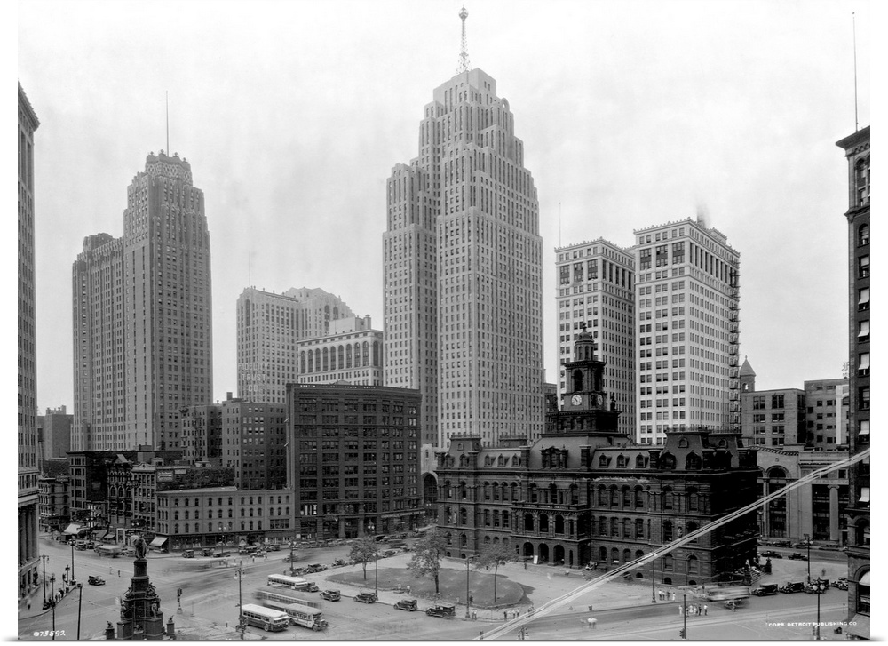 The Guardian Building (tall tower on l) and the Penobscot Building (tall tower on r) tower over a public square in the hea...