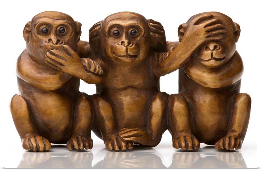 Carving of three wooden monkeys